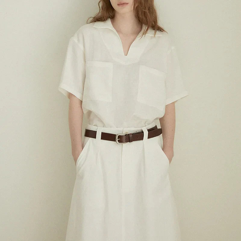 FJØRNA women's linen polo blouse with open collar, casual top featuring a relaxed fit and breathable fabric, stylish and comfortable.