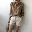 FJØRNA women's linen shirt with open collar, lightweight and breathable tops for women, shown in natural fabric detail.