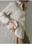 Women’s linen pleated shirt by FJØRNA, stylish lightweight top with a relaxed fit and pleated design, perfect for casual wear.