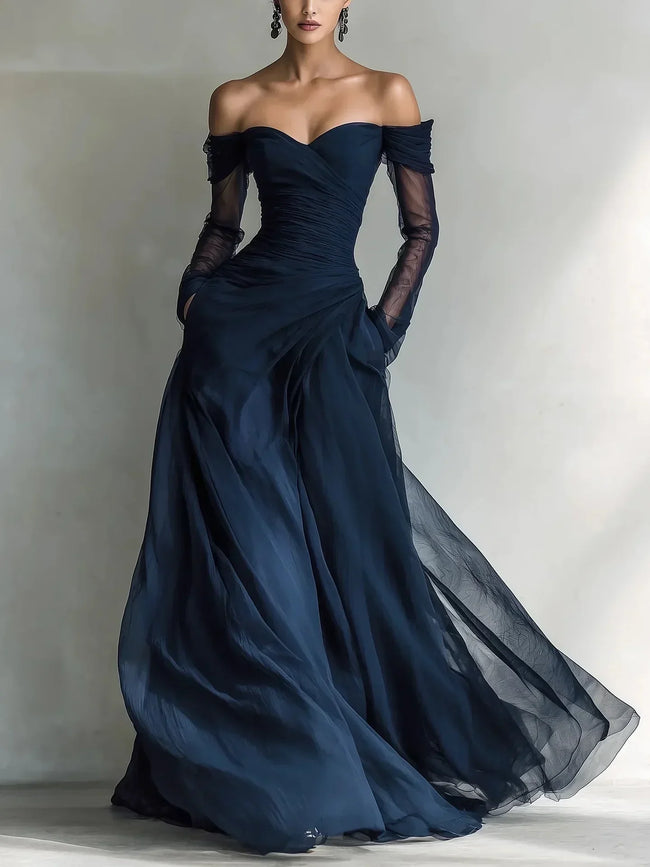 FJØRNA women's off-shoulder summer dress with pleated design, flowing fabric, and stylish fit perfect for warm weather.