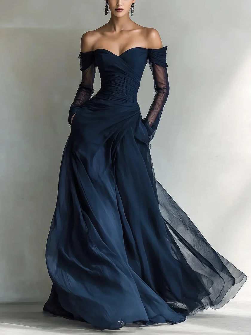 FJØRNA women's off-shoulder summer dress with pleated design, flowing fabric, and stylish fit perfect for warm weather.