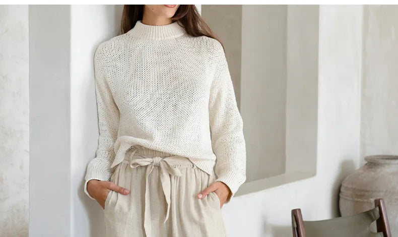 FJØRNA women's linen top with ruffle detail, lightweight and breathable, featuring a stylish and feminine design.