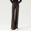 FJØRNA merino wool women's wide leg high waist trousers, stylish and comfortable pants with a sleek fit and natural fabric texture.