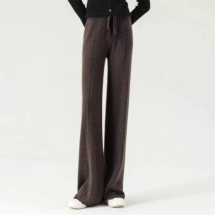 FJØRNA merino wool women's wide leg high waist trousers, stylish and comfortable pants with a sleek fit and natural fabric texture.