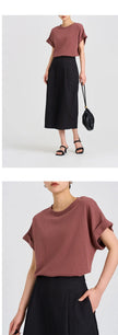 FJØRNA oversized t-shirt with rolled cuffs, soft fabric, relaxed fit, shown in a neutral color, casual streetwear style