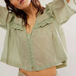 FJØRNA women's cotton blouse with ruffle detail, featuring a stylish and comfortable top for women, shown in the product image.