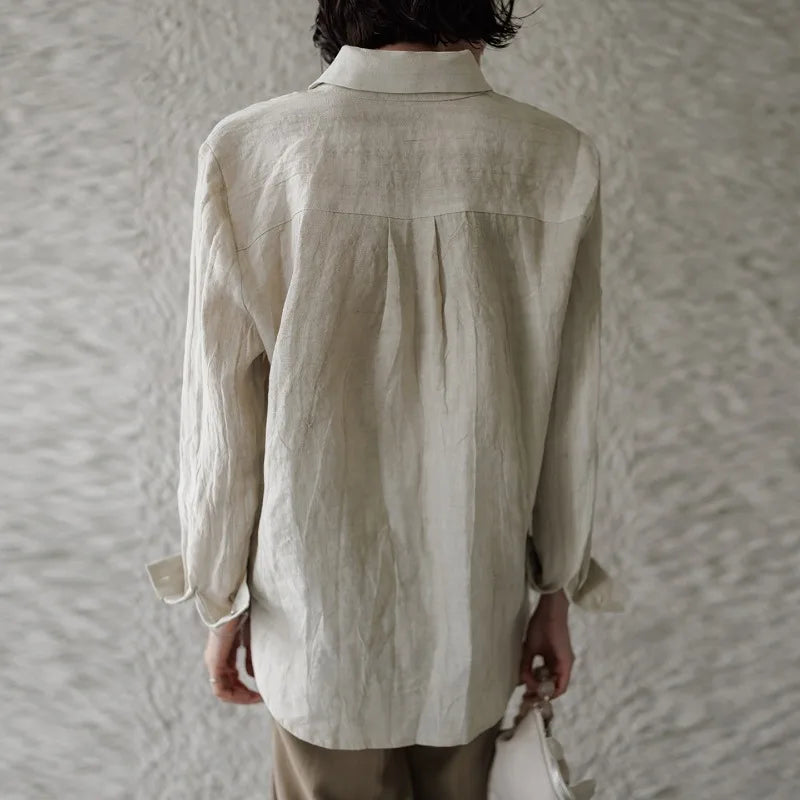 FJØRNA women's linen shirt with pleated design, long sleeves, and a relaxed fit, perfect for casual and stylish summer wear.