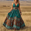 FJØRNA Calisara printed empire waist maxi dress in white with floral pattern, flowing fabric, and elegant design.