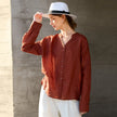 FJØRNA women's linen V-neck shirt, lightweight and breathable top, shown in natural fabric with a relaxed fit.