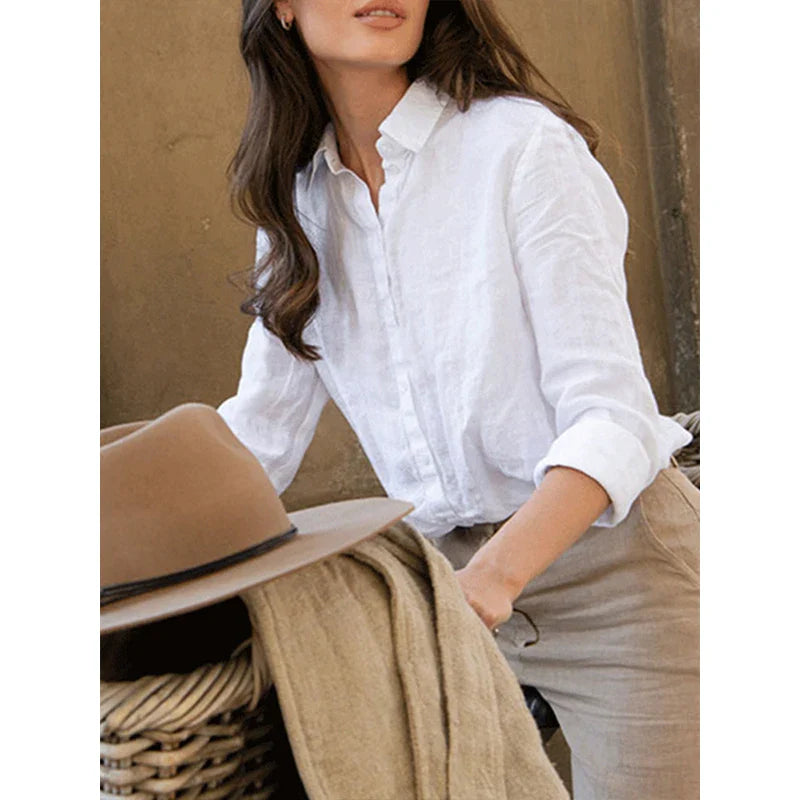 Light beige linen blouse for women by FJØRNA, featuring a relaxed fit and breathable fabric, perfect for casual or office wear.