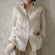 FJØRNA women's linen shirt with pleated design, showcasing a lightweight, stylish top perfect for casual or office wear.