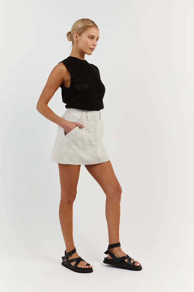 FJØRNA women's sleeveless knit tank top featuring a ribbed texture and fitted style, perfect for casual summer wear.