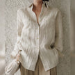FJØRNA women's linen pleated shirt, lightweight tops with a relaxed fit and classic design, shown in natural fabric detail.