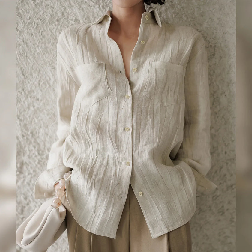 FJØRNA women's linen pleated shirt, lightweight tops with a relaxed fit and classic design, shown in natural fabric detail.