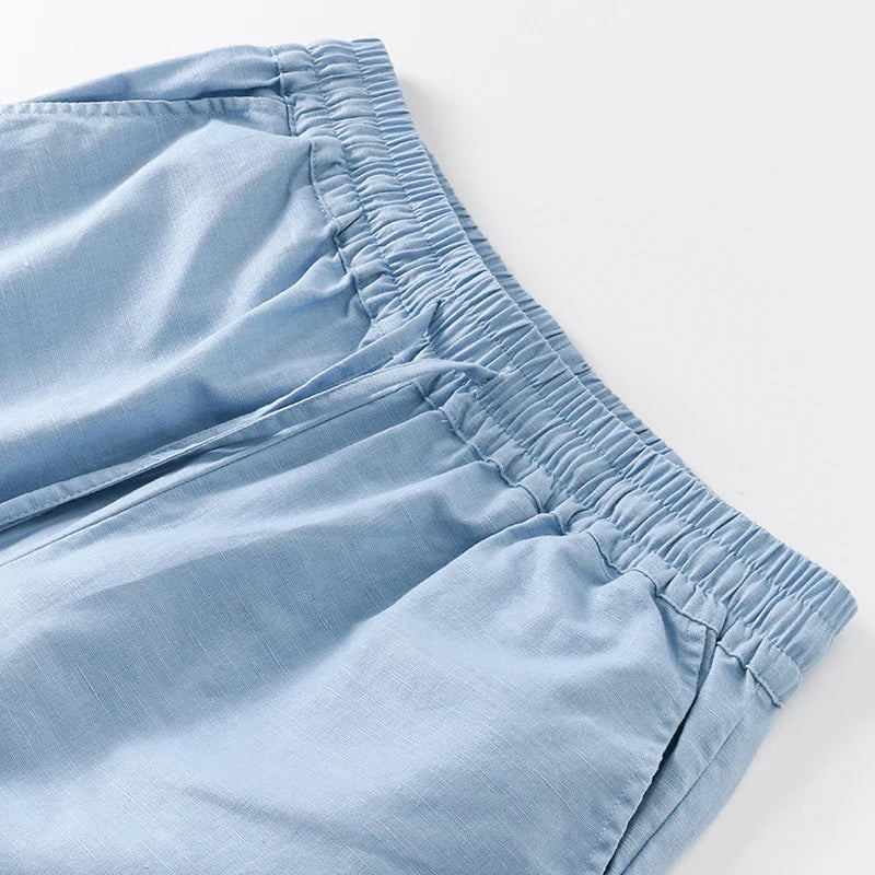 Women’s cotton linen wide-leg trousers by FJØRNA with drawstring pull-on design, relaxed fit, perfect for casual wear.