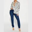 FJØRNA satin blouse for women, stylish women’s tops with smooth, shiny fabric, featuring a flattering fit and elegant design.