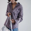 FJØRNA women's linen shirt with pleated design, featuring a relaxed fit and lightweight breathable fabric for stylish comfort.