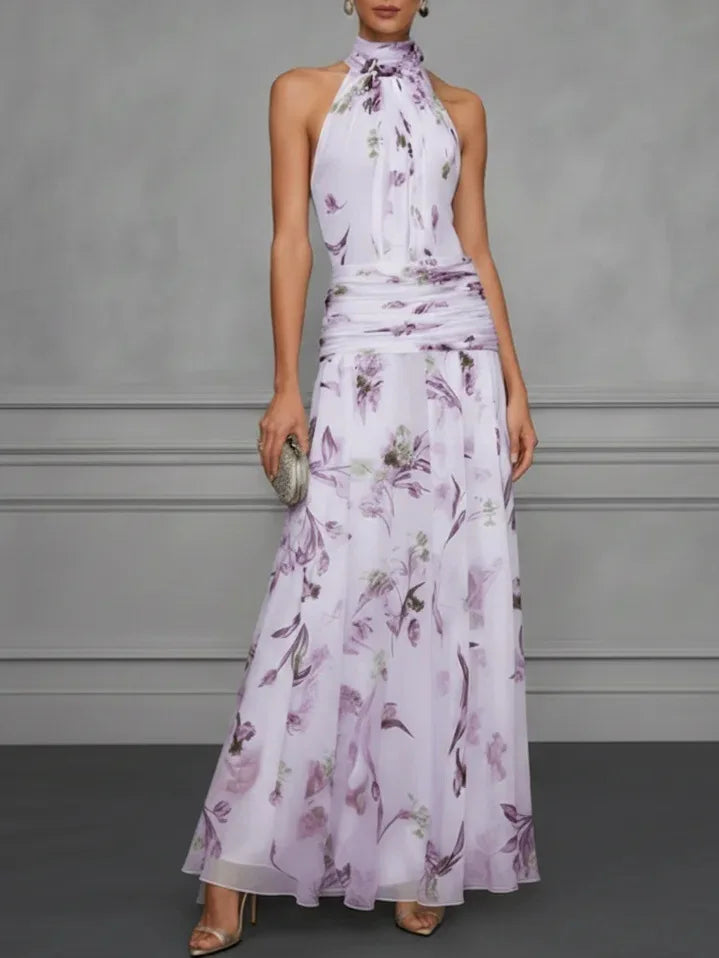 FJØRNA Jasmine floral halter wedding guest dress with elegant floral pattern and flowing fabric, suitable for special occasions