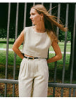 FJØRNA women's linen crop top, lightweight and breathable, shown in a natural fit with short sleeves and a stylish neckline.