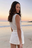 FJØRNA women's sleeveless knit tank top displayed on a hanger, showcasing its soft, textured fabric and classic sleeveless design.
