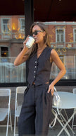 FJØRNA women's linen wide-leg trousers from co-ord set, relaxed fit pants with breathable fabric and flowing silhouette.