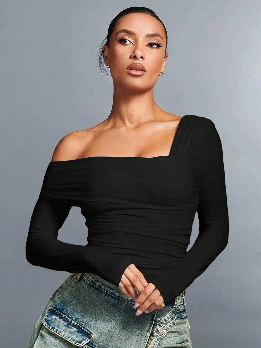 Off-shoulder women's cotton top by FJØRNA featuring a relaxed fit and soft fabric, shown in a stylish, casual design.