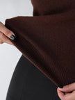 FJØRNA women's sleeveless wool vest, stylish tops with a cozy, textured knit fabric, worn as a layered or standalone piece.