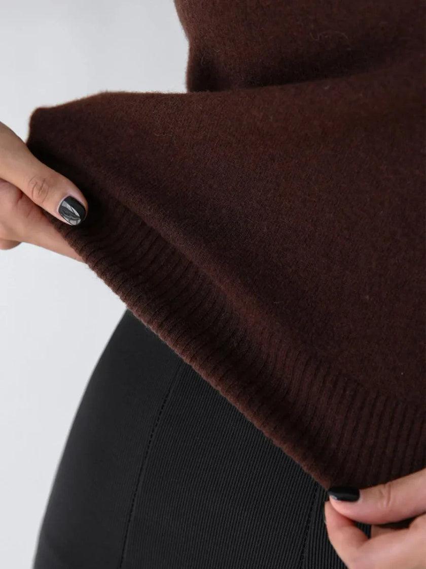FJØRNA women's sleeveless wool vest, stylish tops with a cozy, textured knit fabric, worn as a layered or standalone piece.