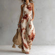 FJØRNA Madison Flowy Halter Maxi Dress in white, sleeveless design with a flowing silhouette and halter neckline.