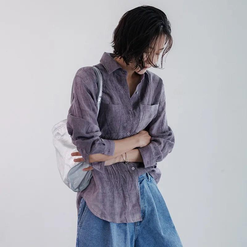 FJØRNA women's linen shirt with pleated design, featuring lightweight, breathable fabric and a relaxed fit top.