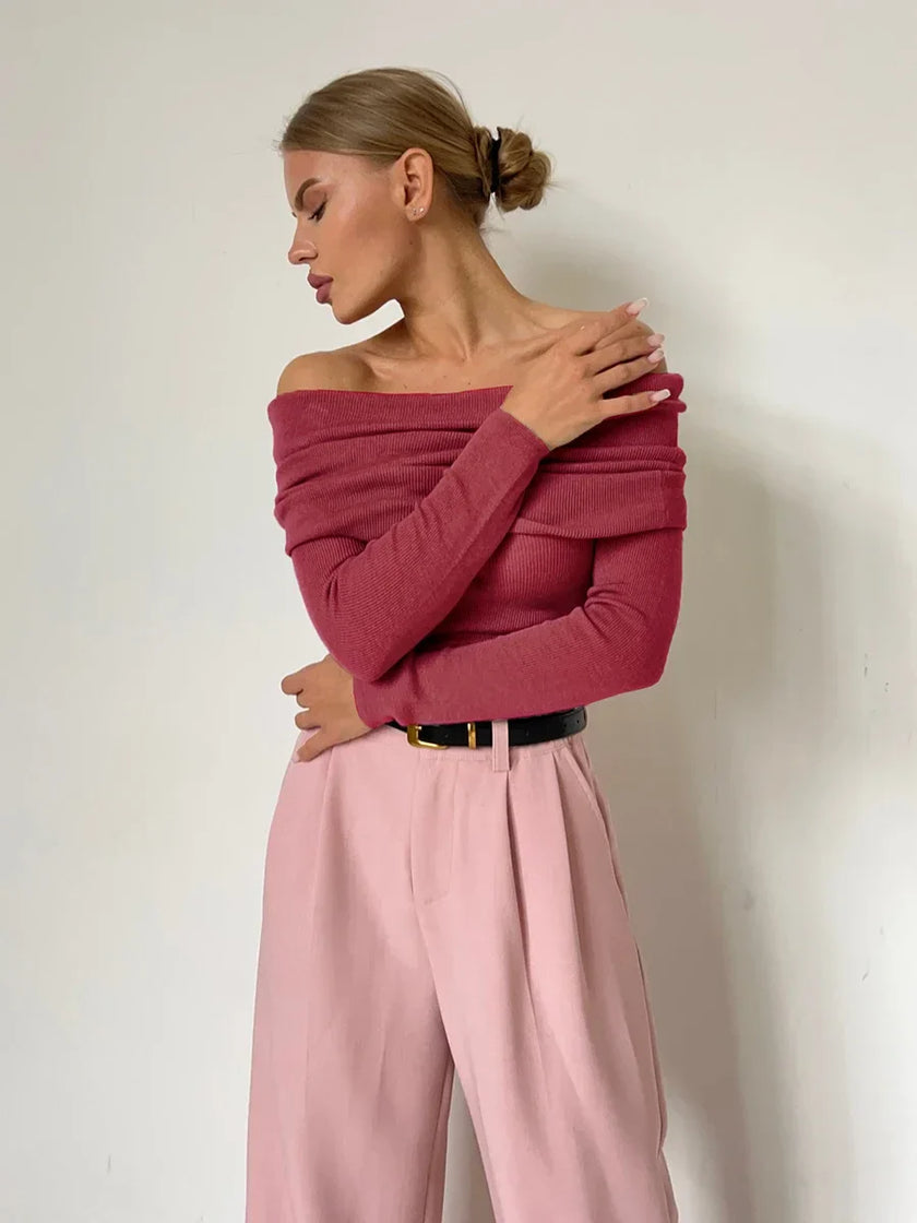 Off-shoulder ribbed knit top for women by FJØRNA, shown in a close-up highlighting the textured fabric and stylish neckline.