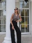 FJØRNA women's linen blend wide-leg high-waist trousers, shown in a natural drape with a relaxed fit and subtle texture.