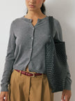 FJØRNA women's knit cardigan, cozy long-sleeve top with button-up front, in soft neutral color, stylish and comfortable for everyday wear.