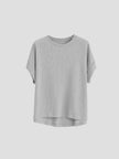 FJØRNA oversized women's tee with rolled cuffs, relaxed fit, soft fabric, and casual style, displayed on a model.