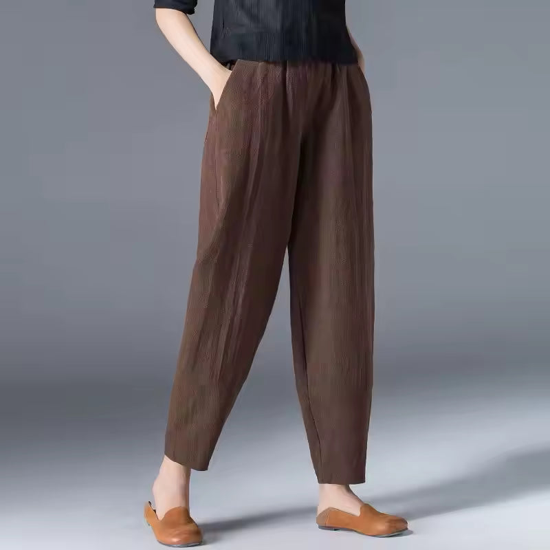 FJØRNA Desiree™ lightweight summer trousers in soft fabric, shown in a relaxed fit with side pockets and a neutral color.