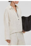 Women's linen polo top with collar by FJØRNA, featuring a lightweight, breathable fabric and classic collar design.