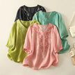 FJØRNA women's cotton V-neck blouse, stylish and comfortable tops for women, shown in a light-colored fabric.