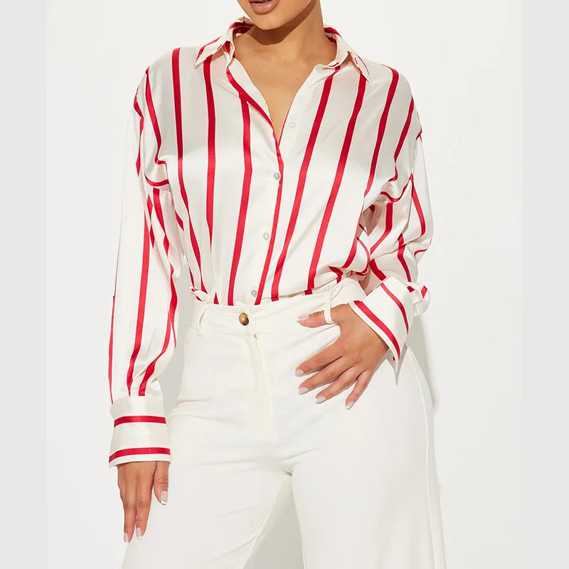 FJØRNA satin blouse for women featuring a sleek, elegant design with long sleeves and a smooth, shiny fabric.