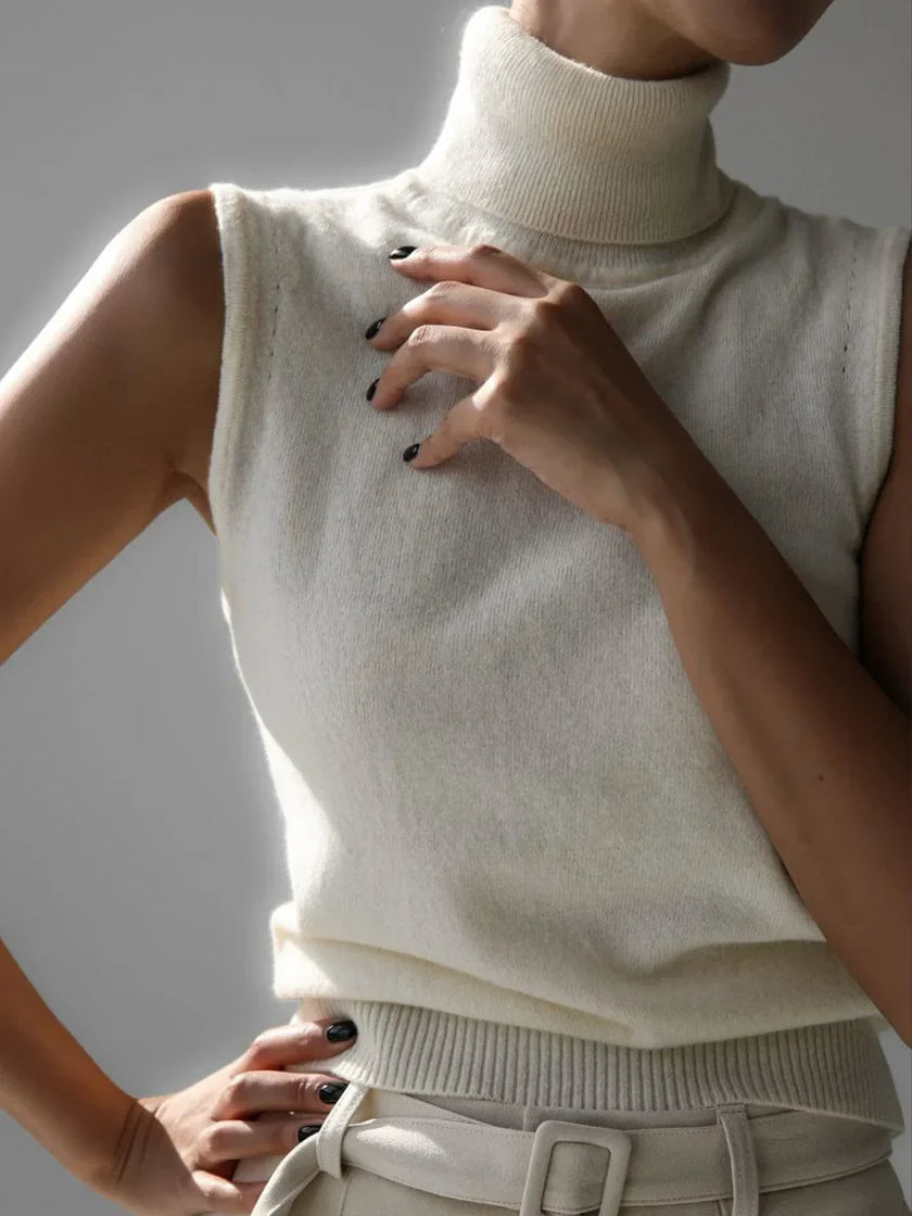 FJØRNA women's sleeveless wool vest, soft and cozy top in a neutral color, perfect for layering and stylish winter wear.