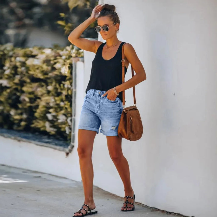 FJØRNA women's lightweight summer shorts with high waist, cropped length, and front pockets, perfect for warm weather.