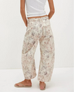 FJØRNA women's wide-leg denim jeans showing high-waisted fit and relaxed silhouette with classic blue denim fabric.