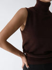 FJØRNA women's sleeveless wool vest, close-up of soft, knitted fabric and tailored fit, ideal for layering in cooler weather.