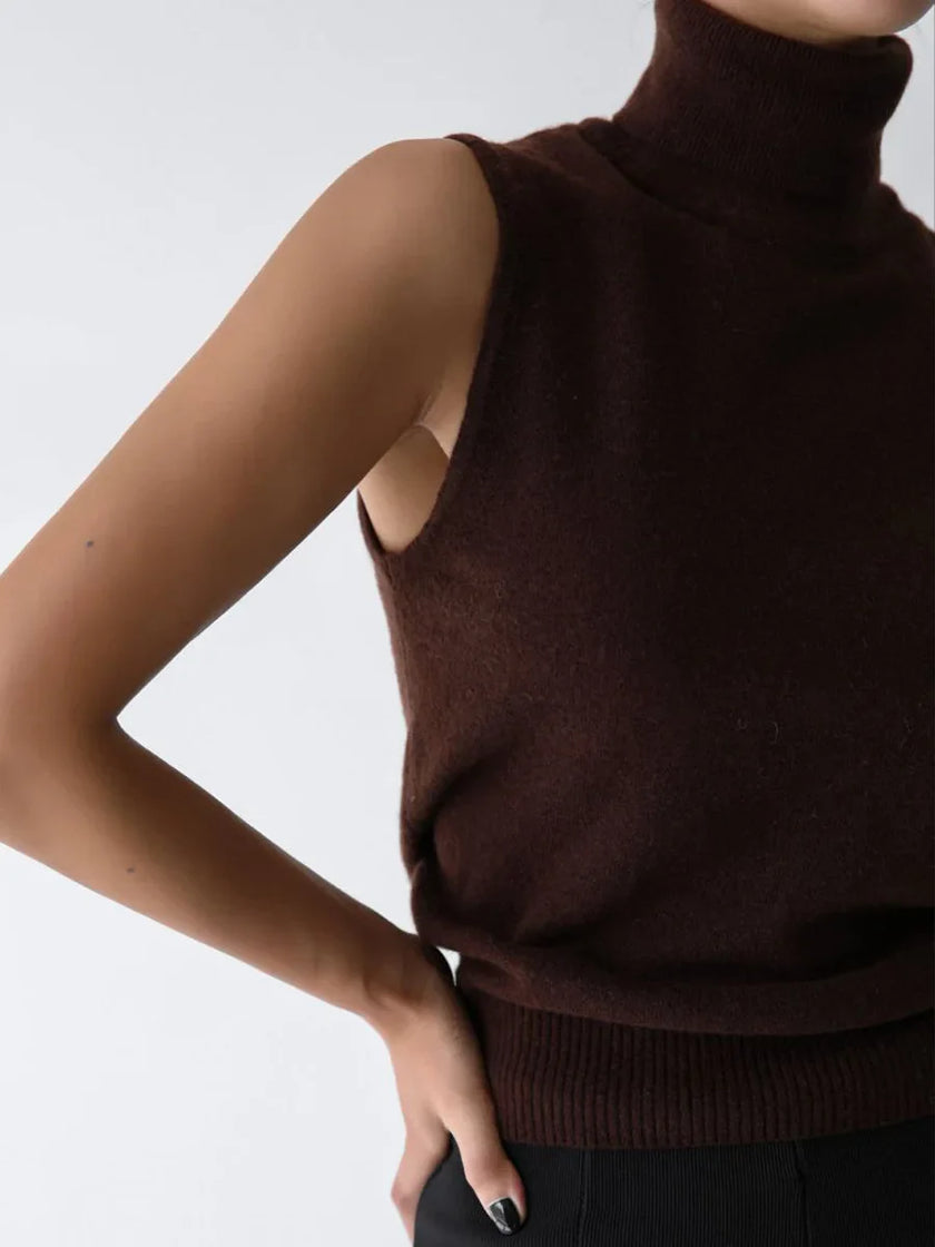 FJØRNA women's sleeveless wool vest, close-up of soft, knitted fabric and tailored fit, ideal for layering in cooler weather.