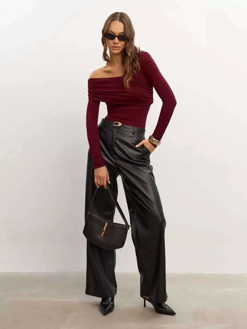 Women’s off-shoulder cotton top by FJØRNA, featuring a stylish, relaxed fit with long sleeves and a soft, breathable fabric.