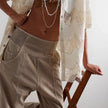 FJØRNA women's wide-leg denim jeans, stylish pants with a relaxed fit, shown on a model with a casual outfit.