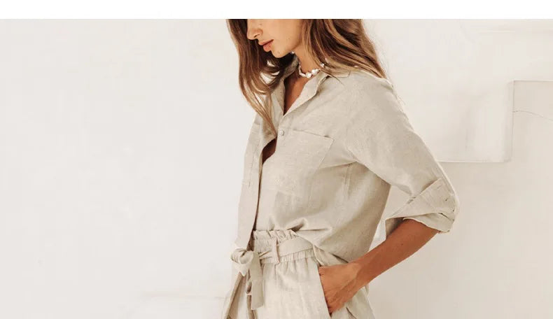 FJØRNA linen wide-leg women's trousers with elastic waist and ruffle detail, styled for a relaxed, comfortable fit.