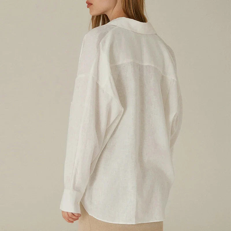 FJØRNA linen shirt with slit hem detail, featuring a relaxed fit and lightweight fabric for casual stylish wear
