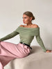 FJØRNA women's off-shoulder ribbed knit top showcasing a fitted, stylish design with long sleeves and a soft texture.