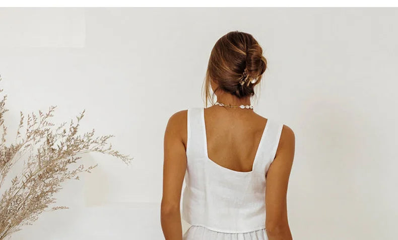 Women’s linen top by FJØRNA with ruffle details, featuring a lightweight, airy design perfect for casual or summer wear.