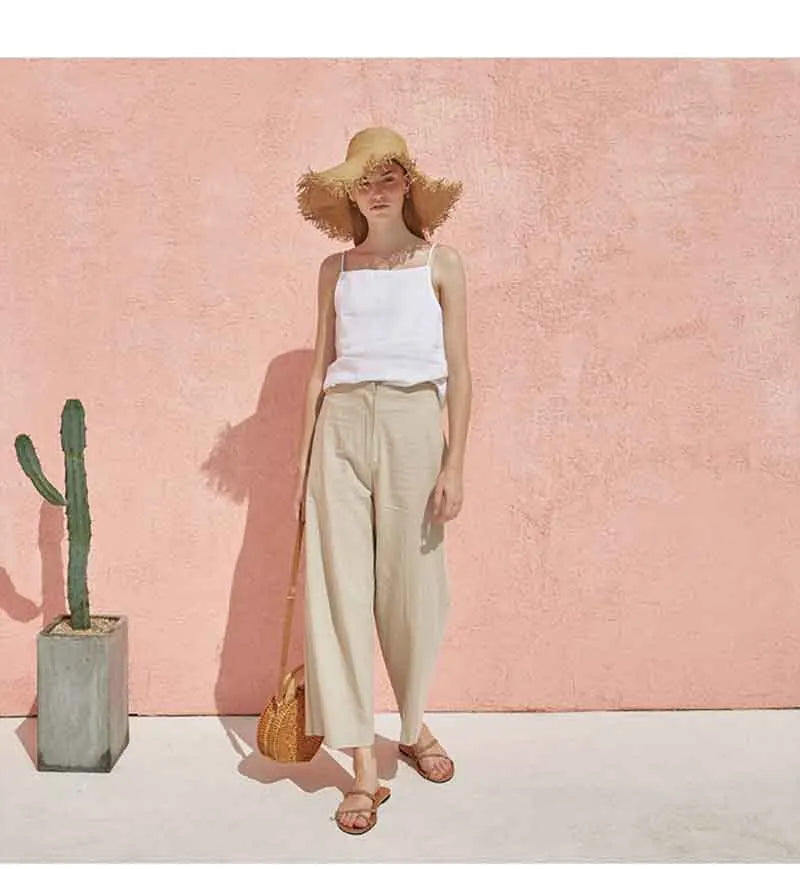 FJØRNA satin-trimmed linen cami top with delicate satin accents and lightweight linen fabric, displayed on a neutral background.